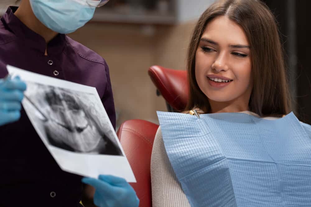 Dentist carefully performing a tooth extraction on a patient in a professional North Sydney dental clinic