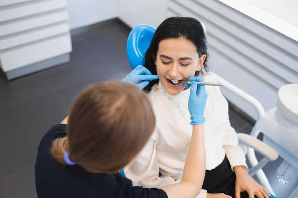 North Sydney Dentist examining a patient’s teeth